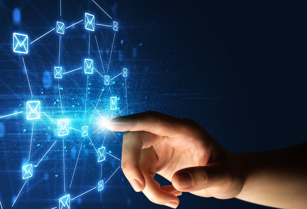 Female finger touching a beam of light surrounded by a blue graphic with envelopes-1